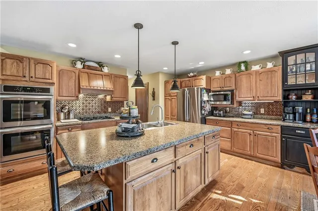 a dining room with furniture window chairs and chandelier