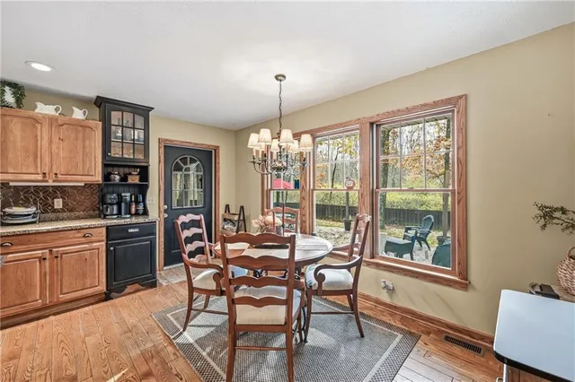 a work room with furniture and a window