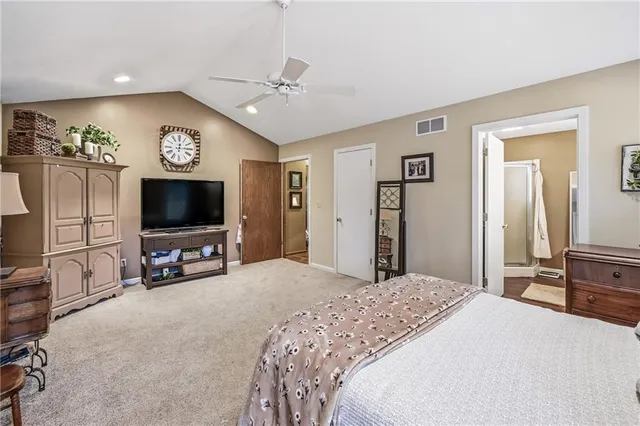 a en suite bathroom with a sink double vanity and a mirror