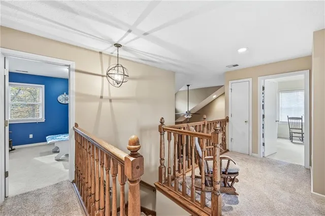 a bedroom with a bed and a chair