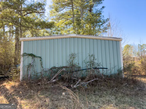 an outdoor space with wooden fence