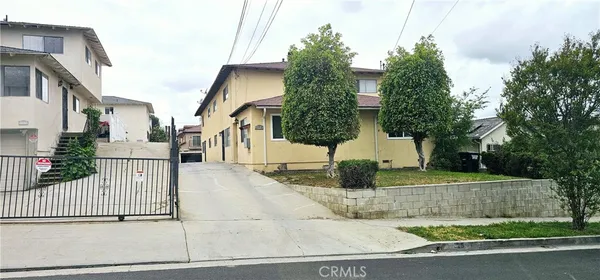 a view of a street with fence