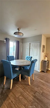 a dining room with a table and chairs