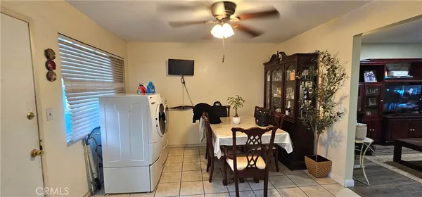 a view of a livingroom with furniture and workspace