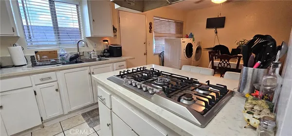 a kitchen with appliances and cabinets