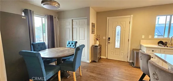 a view of a dining room with furniture and window