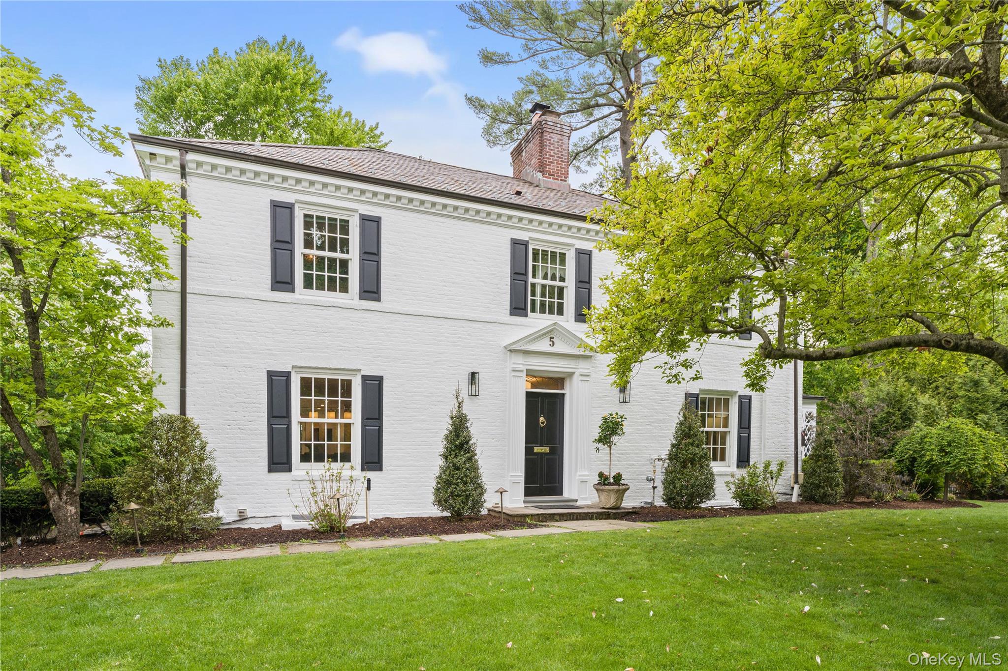 Classic Fox Meadow colonial on idyllic street located within minutes to Village, train, shopping, schools, library and parks!