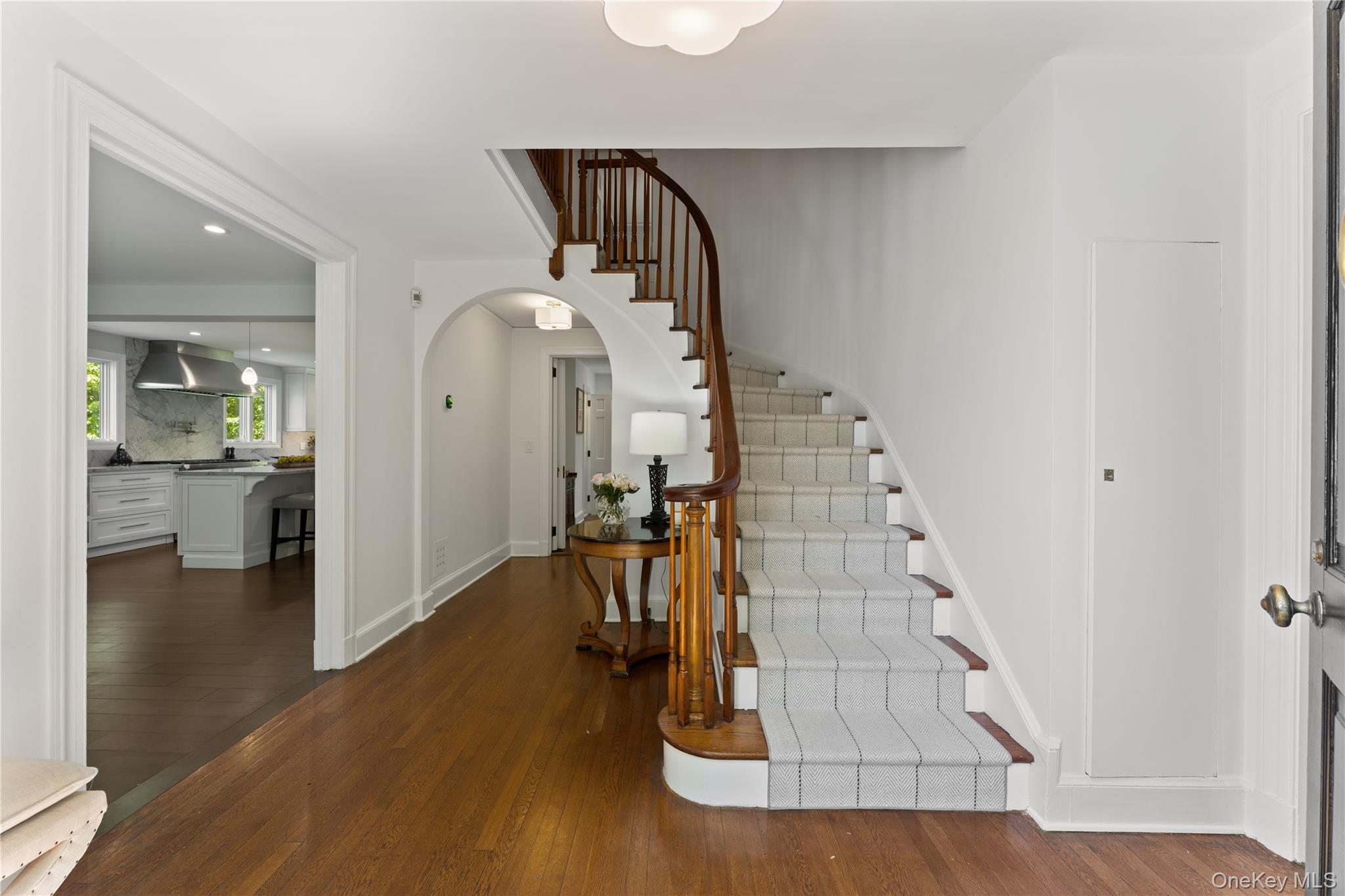 5 Harcourt Road Scarsdale, NY 10583 - Photo 13 of 44 Elegant curved staircase leads to second floor