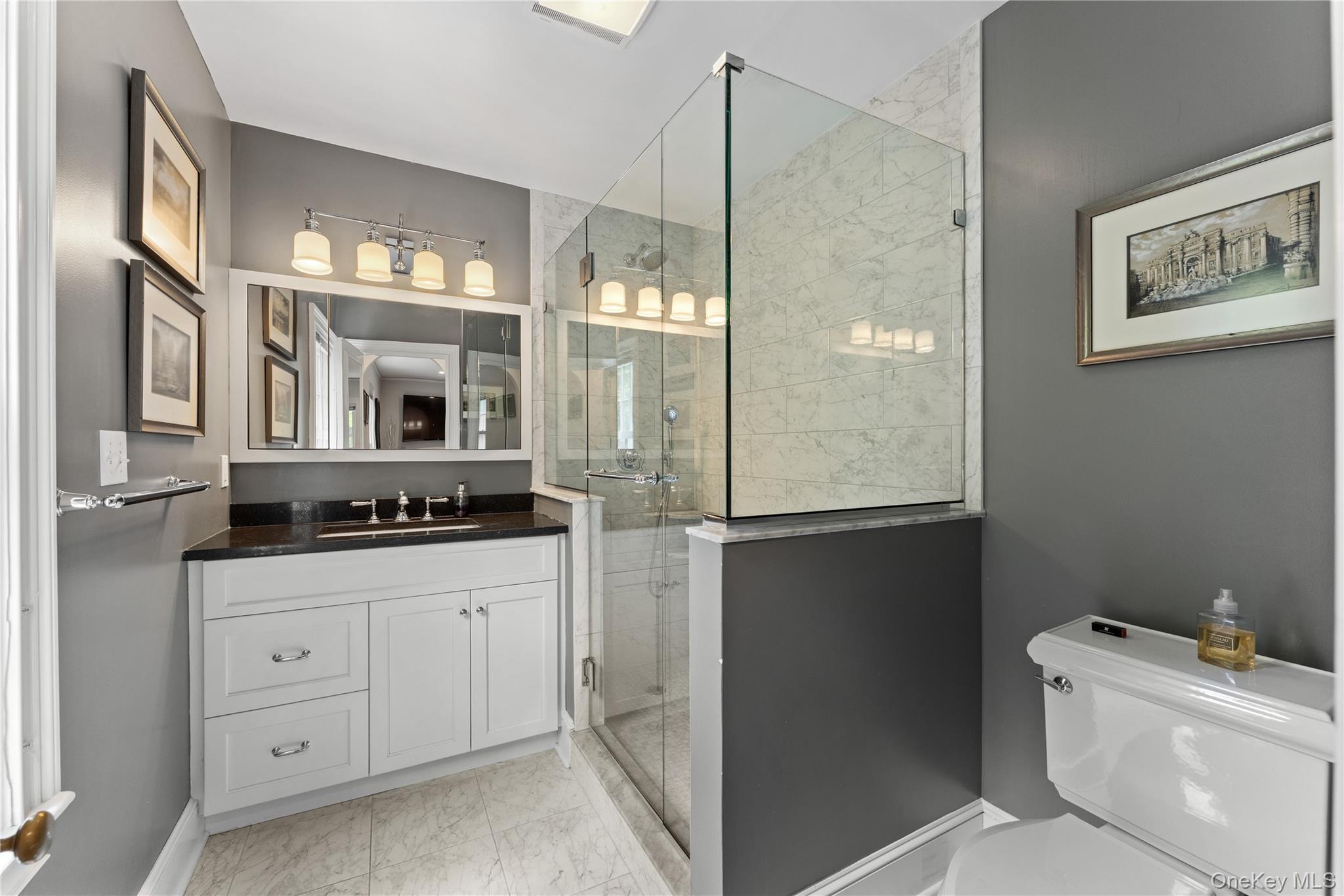 5 Harcourt Road Scarsdale, NY 10583 - Photo 16 of 44 Primary bathroom with stall shower with seamless glass enclosure