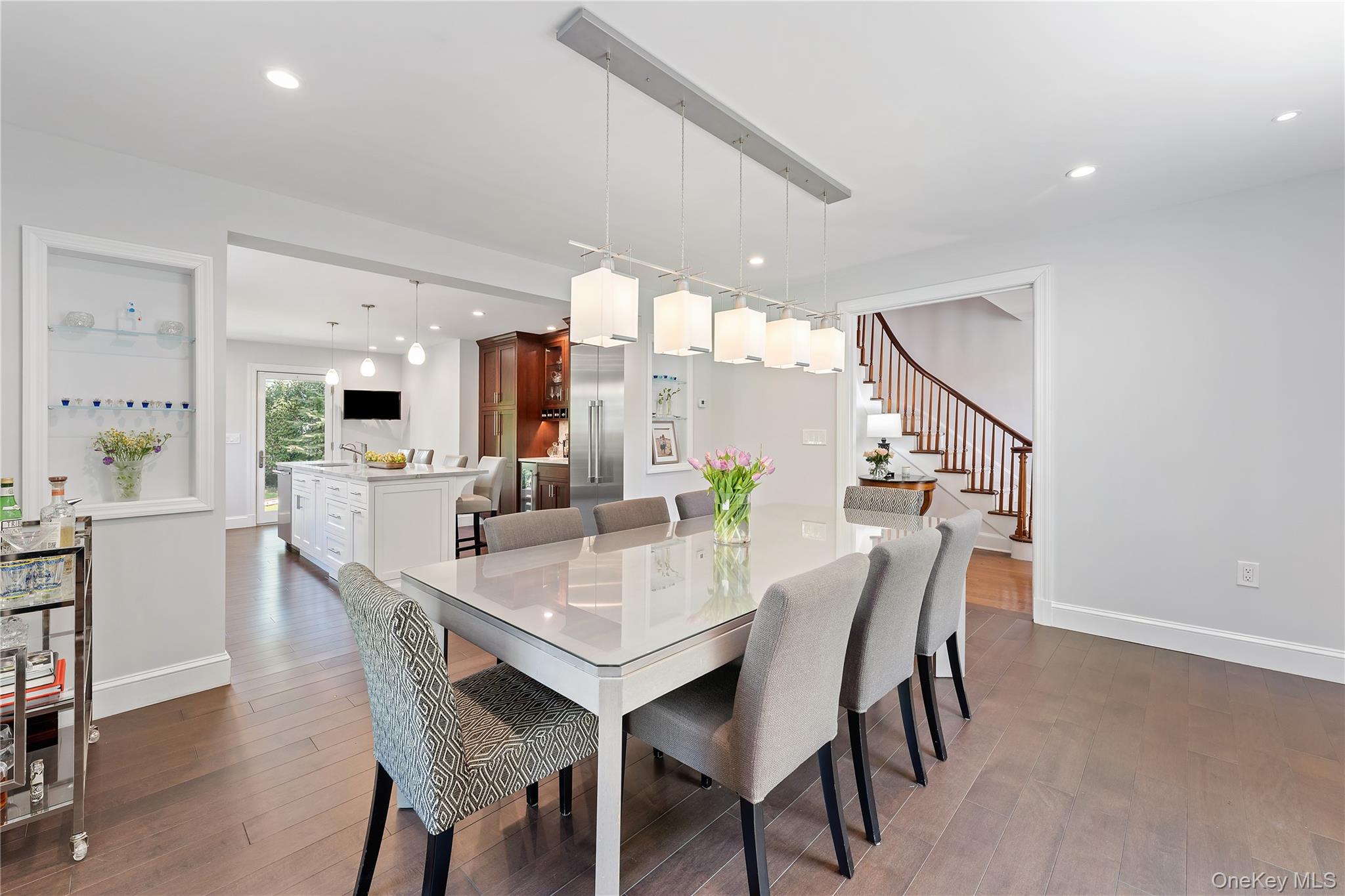 5 Harcourt Road Scarsdale, NY 10583 - Photo 2 of 44 Entry foyer with curved staircase leads to new open kitchen/dining room