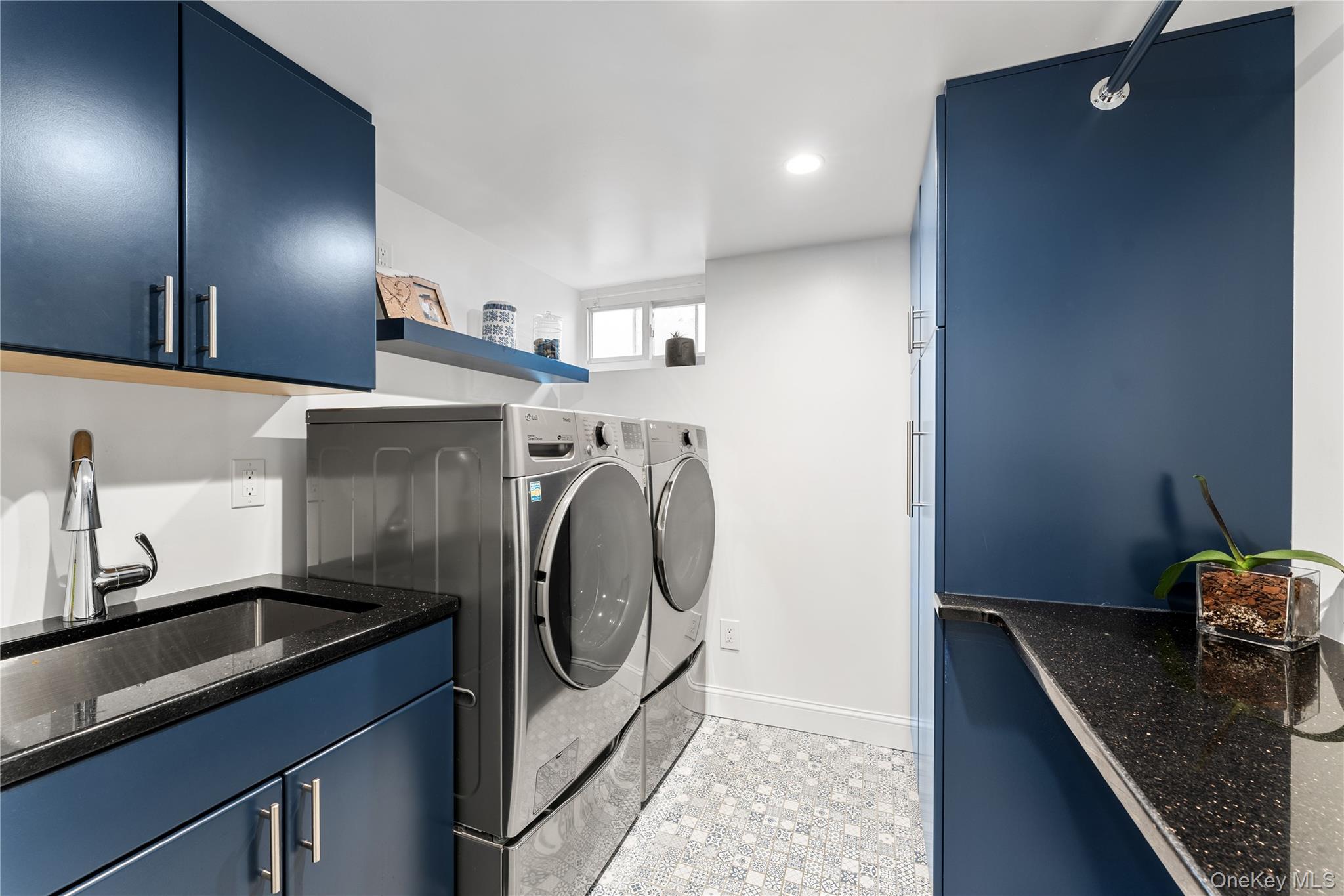 5 Harcourt Road Scarsdale, NY 10583 - Photo 26 of 44 Lower level laundry room with buit in cabinetry