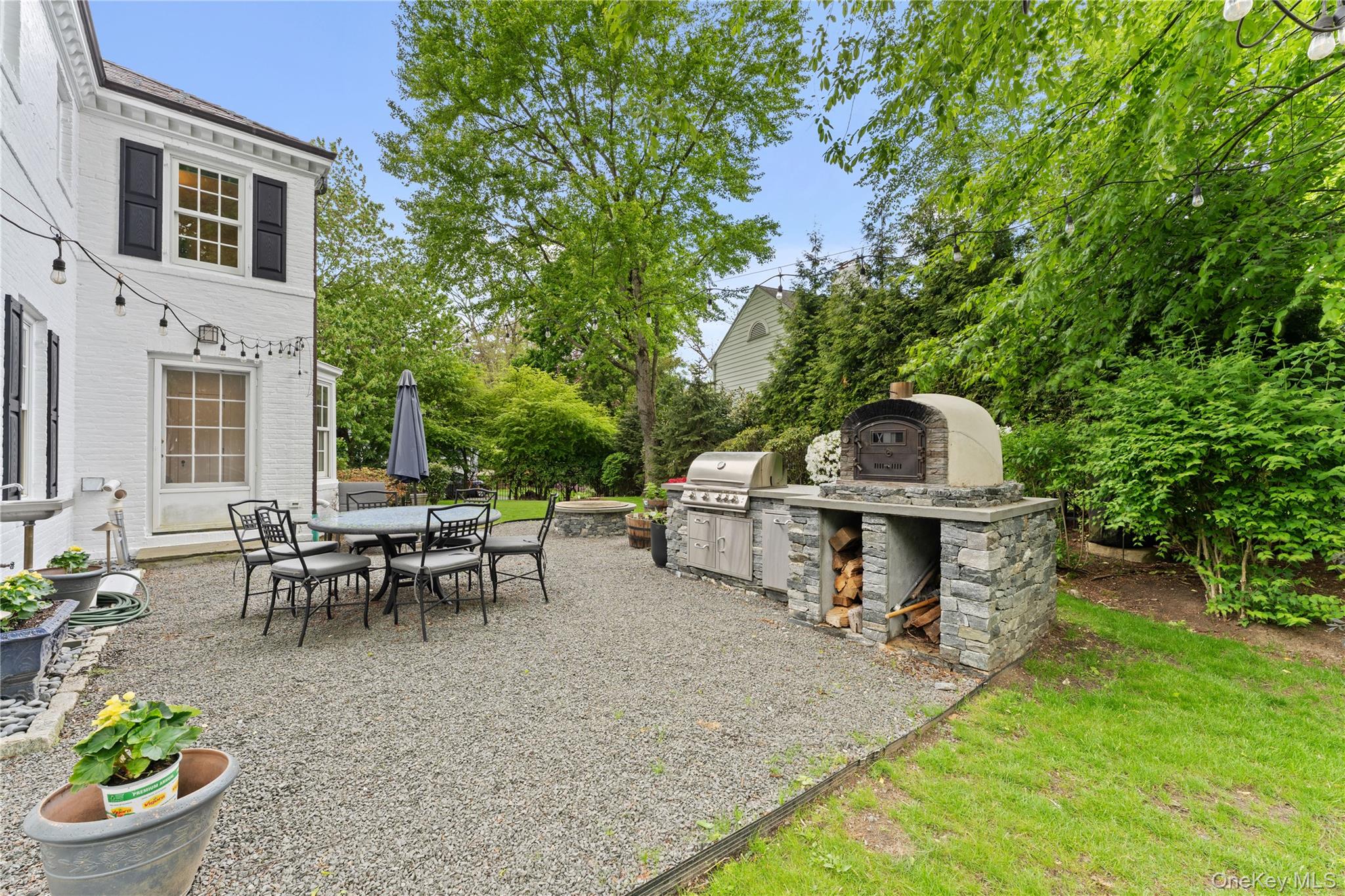 5 Harcourt Road Scarsdale, NY 10583 - Photo 30 of 44 Experience a taste of italy in your own backyard with a built in pizza oven!