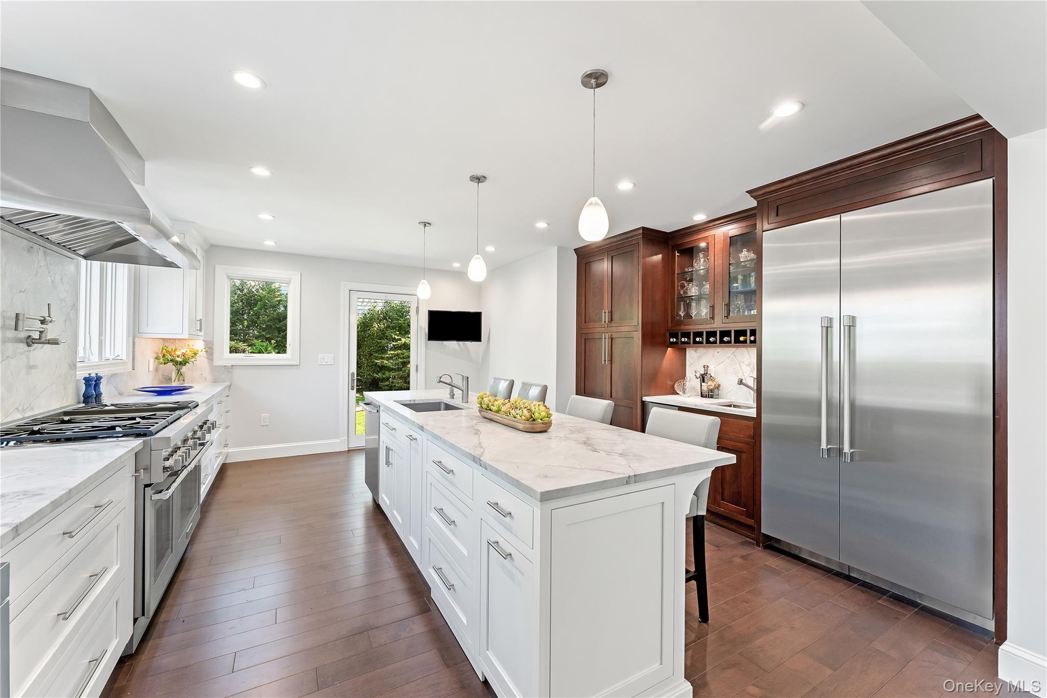 5 Harcourt Road Scarsdale, NY 10583 - Photo 3 of 44 Gourmet kitchen with fleet of upscale applaicnes including 6 burner range, built in micrwowave, warming drawer, pot filler, and wine refrigerator