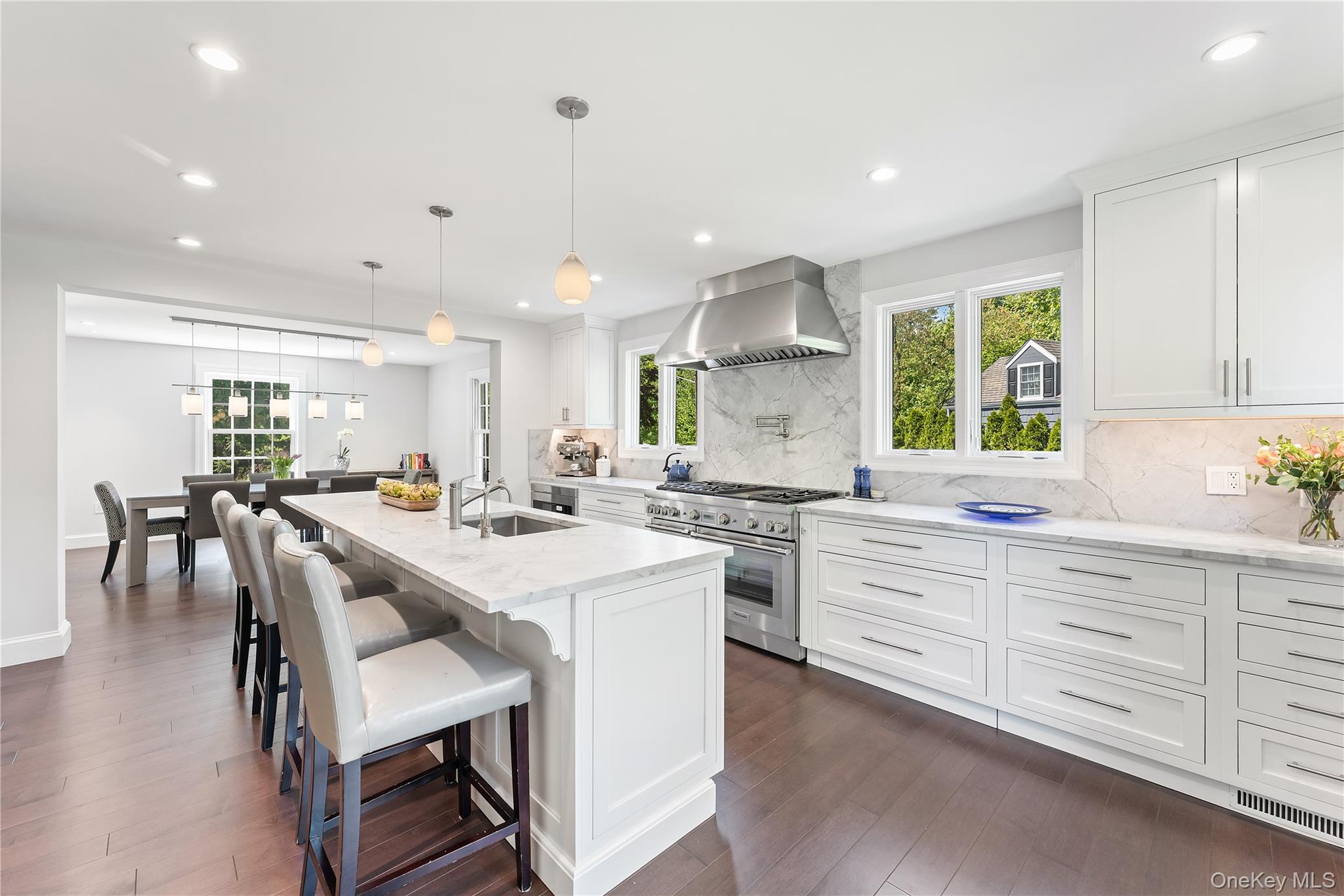 5 Harcourt Road Scarsdale, NY 10583 - Photo 4 of 44 Huge center island with quartz countertops and custom cabinetry throughout