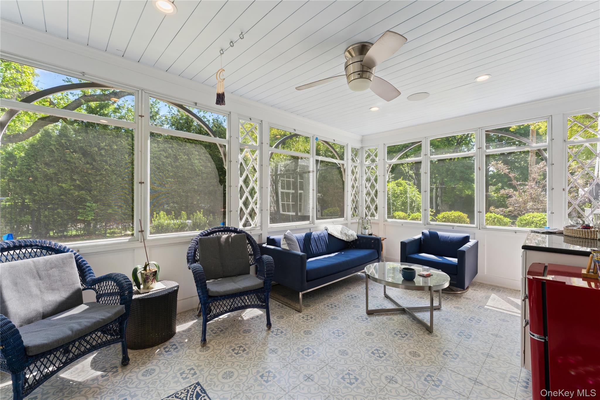 5 Harcourt Road Scarsdale, NY 10583 - Photo 9 of 44 Sun drenched sanctuary with views of backyard seamlessly merges indoor comfort with an outdoor feel that will become one of the favorite rooms of the house!