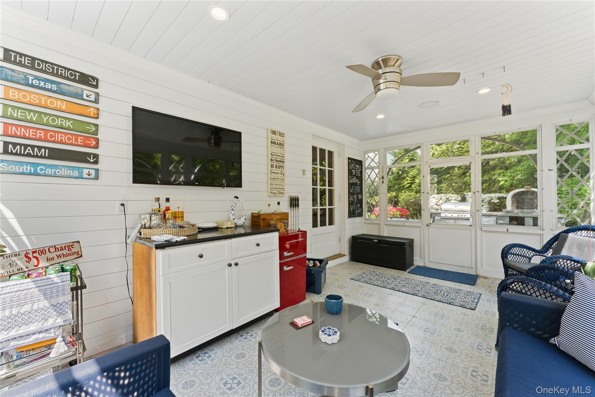 5 Harcourt Road Scarsdale, NY 10583 - Photo 10 of 44 Views of sun porch open to the backyard