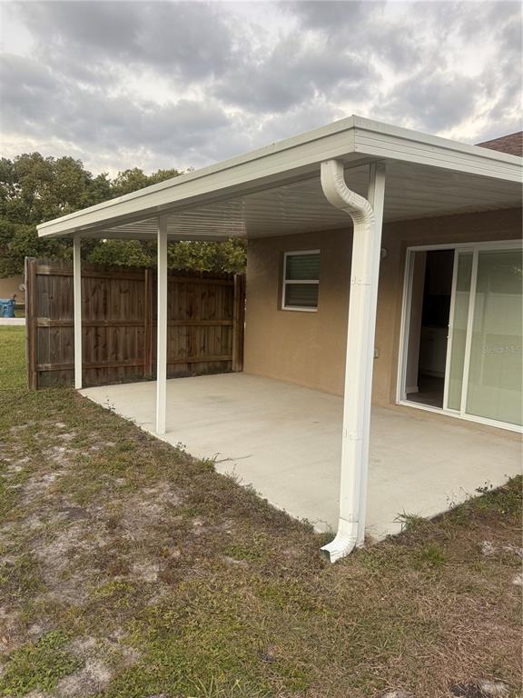 2596 Landover Boulevard Spring Hill, FL 34608 - Photo 15 of 16 front view of a house with a yard