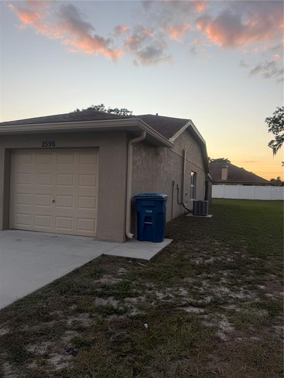 2596 Landover Boulevard Spring Hill, FL 34608 - Photo 2 of 16 a front view of a house with a yard