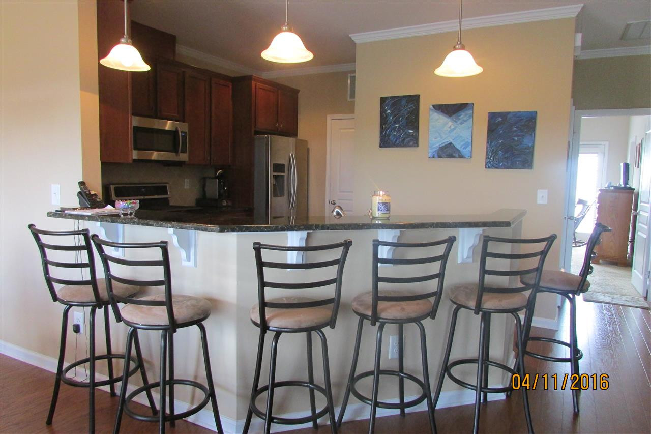9134 Wooden Road Raleigh, NC 27617 - Photo 12 of 25 view from bar into kitchen
