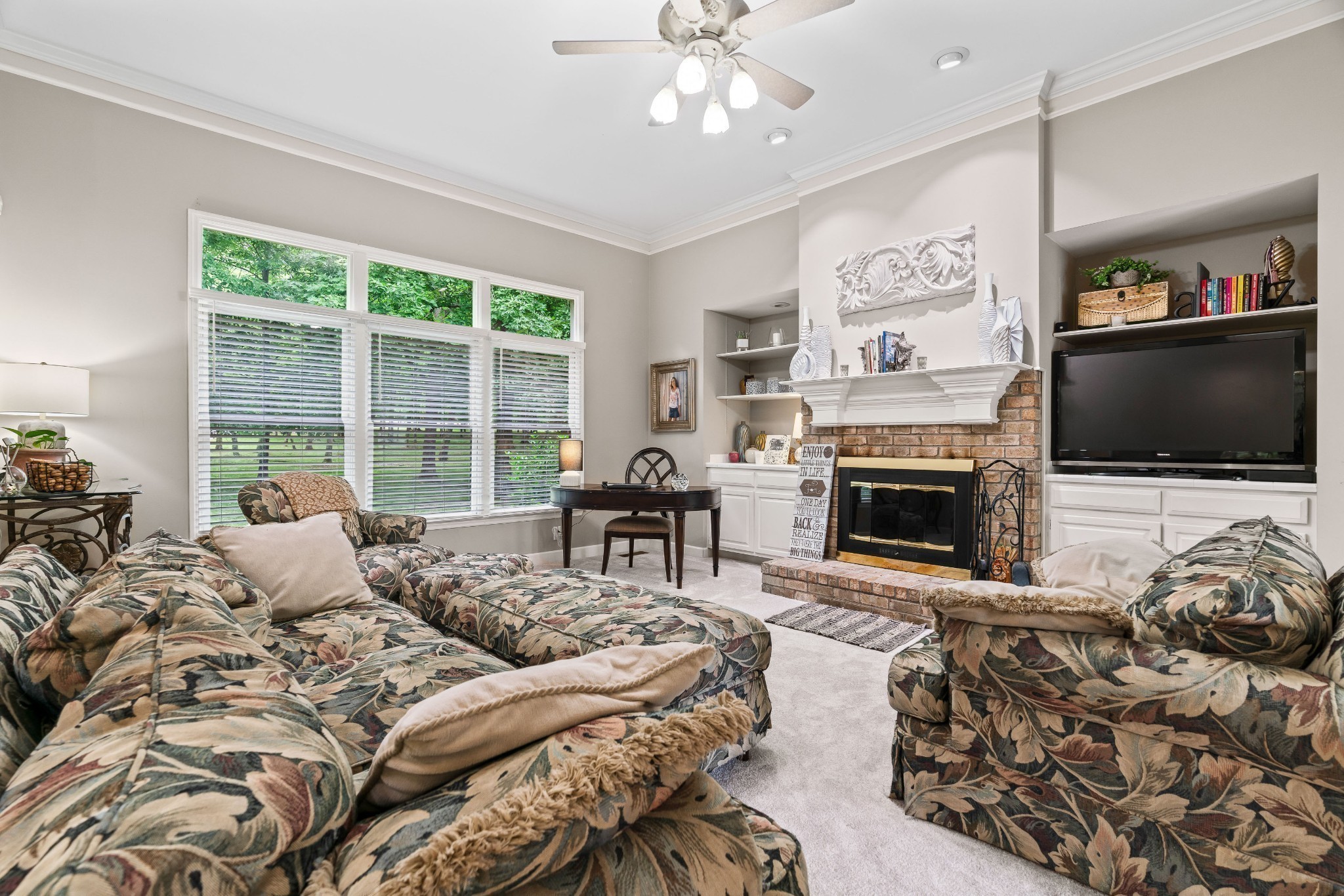 5544 South New Hope Road Hermitage, TN 37076 - Photo 3 of 62 a bedroom with furniture a flat screen tv and a fireplace