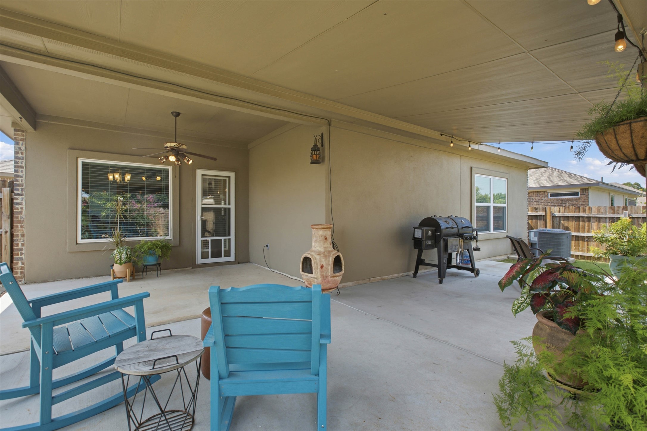 2413 Bridges Ranch Road Georgetown, TX 78628 - Photo 27 of 31 An inviting covered patio offers an ideal spot for outdoor living and entertaining.