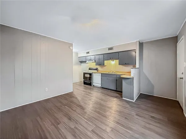 a view of kitchen with wooden floor