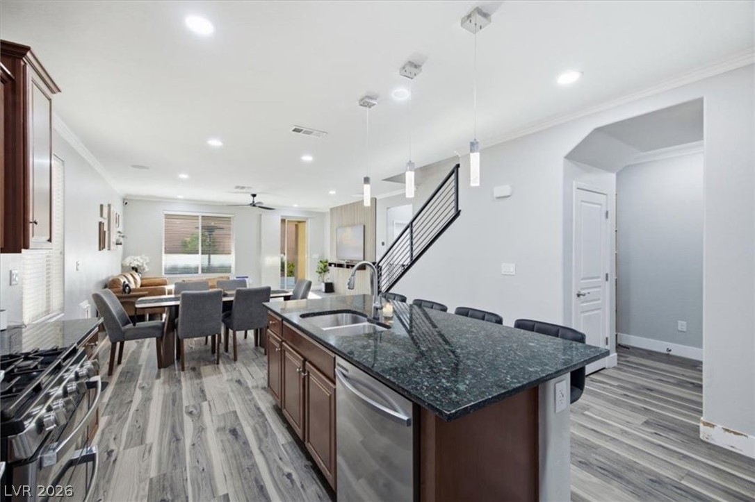 11009 Prairie Grove Road Las Vegas, NV 89179 - Photo 11 of 49 An open-concept living space with an inviting kitchen island and contemporary finishes.