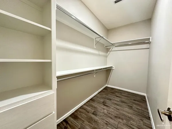 a view of an empty walk in closet