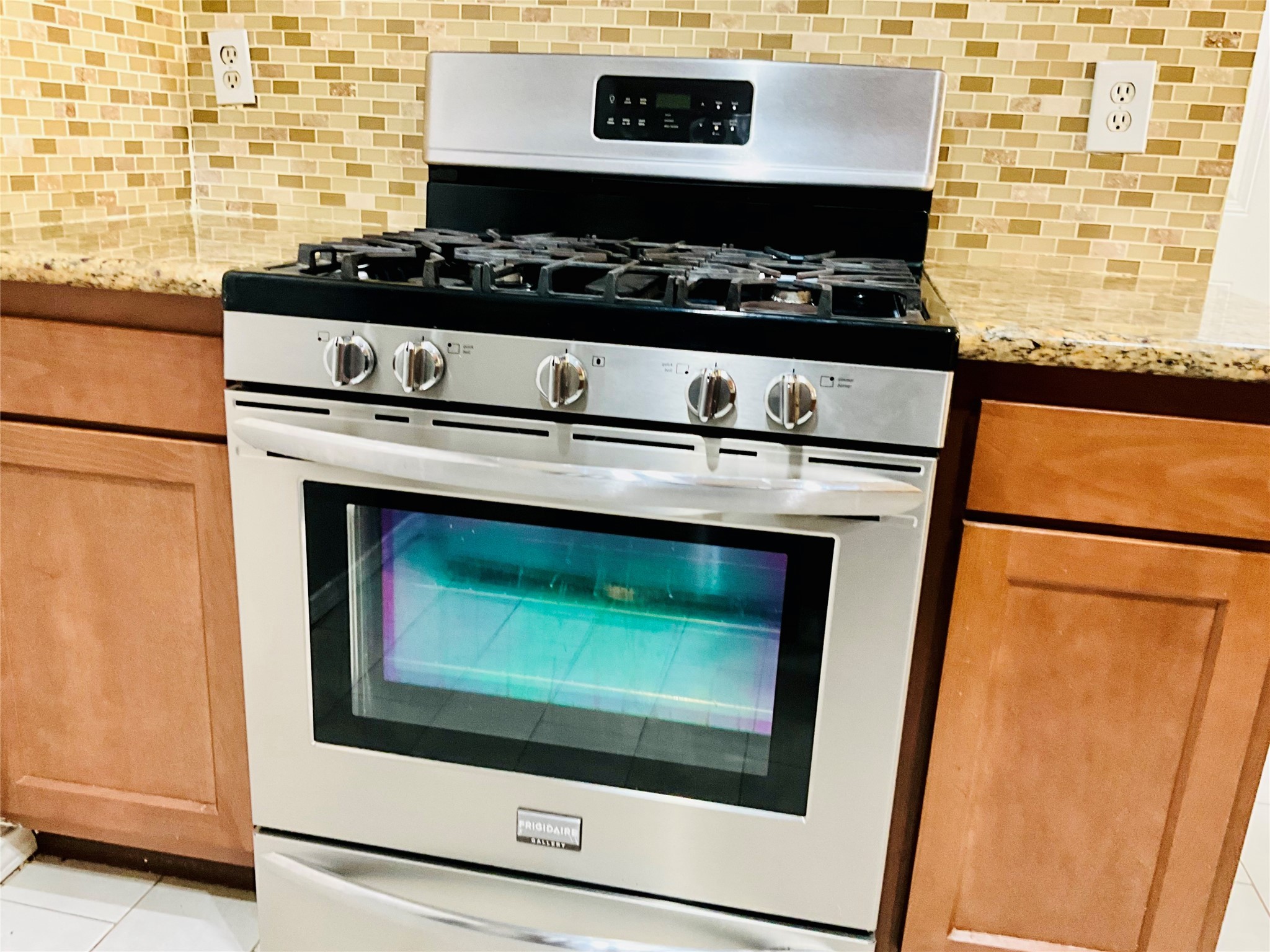 11827 Moss Branch Road Houston, TX 77043 - Photo 14 of 41 a stove top oven sitting inside of a kitchen