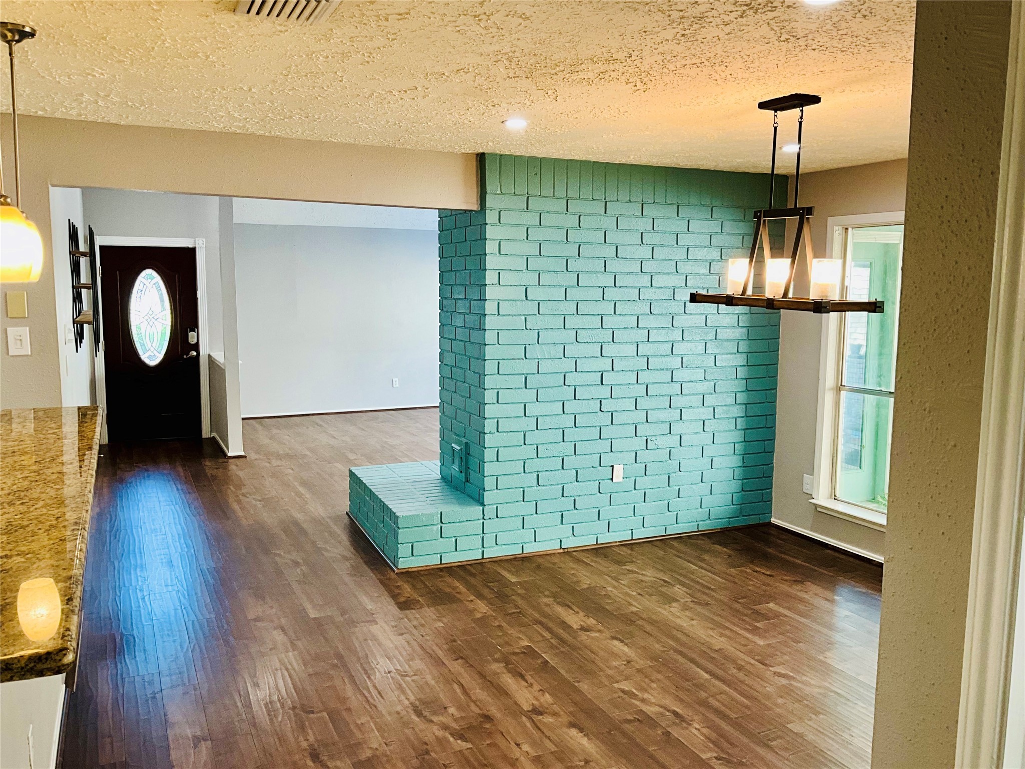 11827 Moss Branch Road Houston, TX 77043 - Photo 16 of 41 a view of empty room with wooden floor and fan