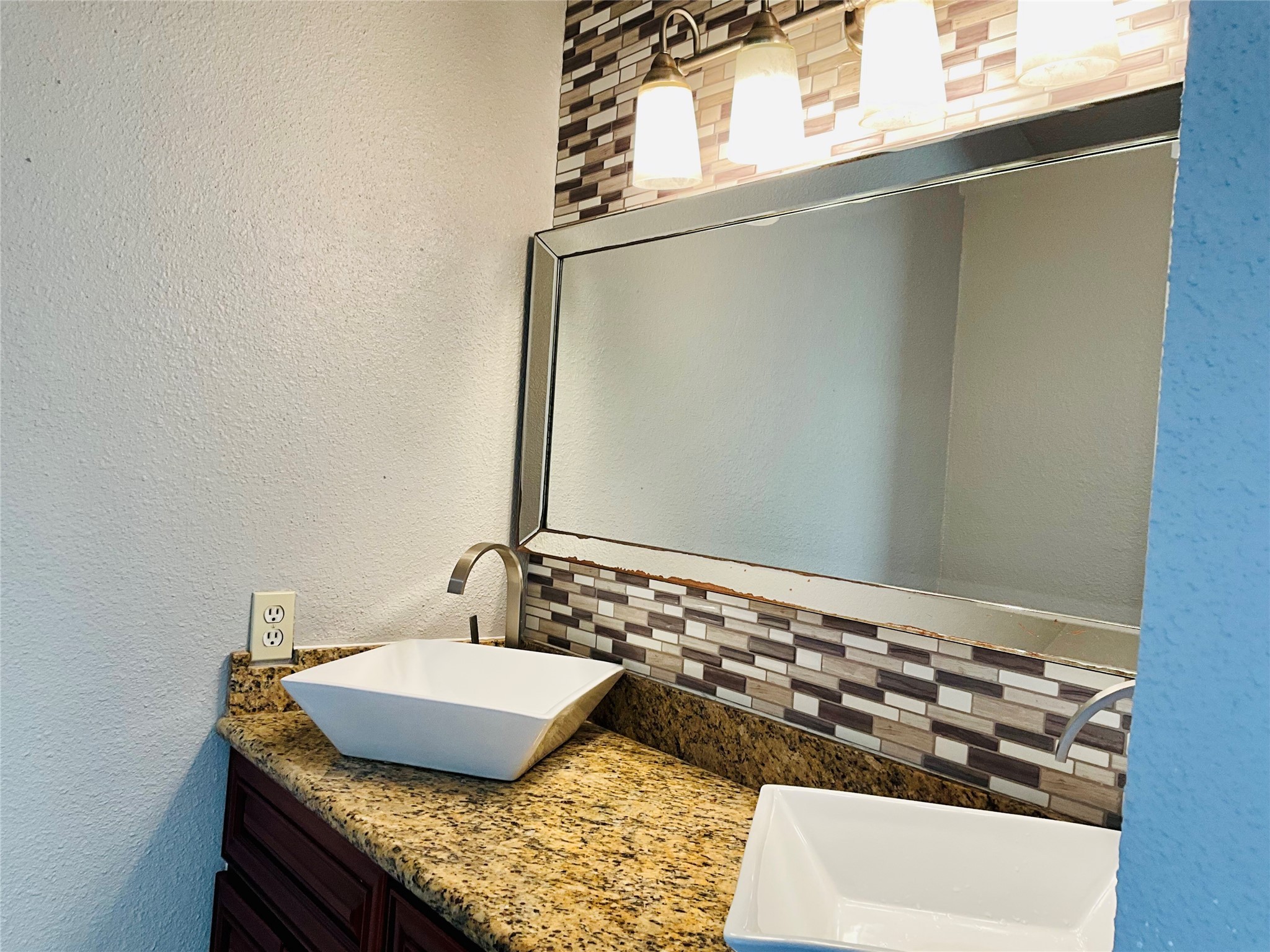 11827 Moss Branch Road Houston, TX 77043 - Photo 21 of 41 a bathroom with a granite countertop sink and a mirror