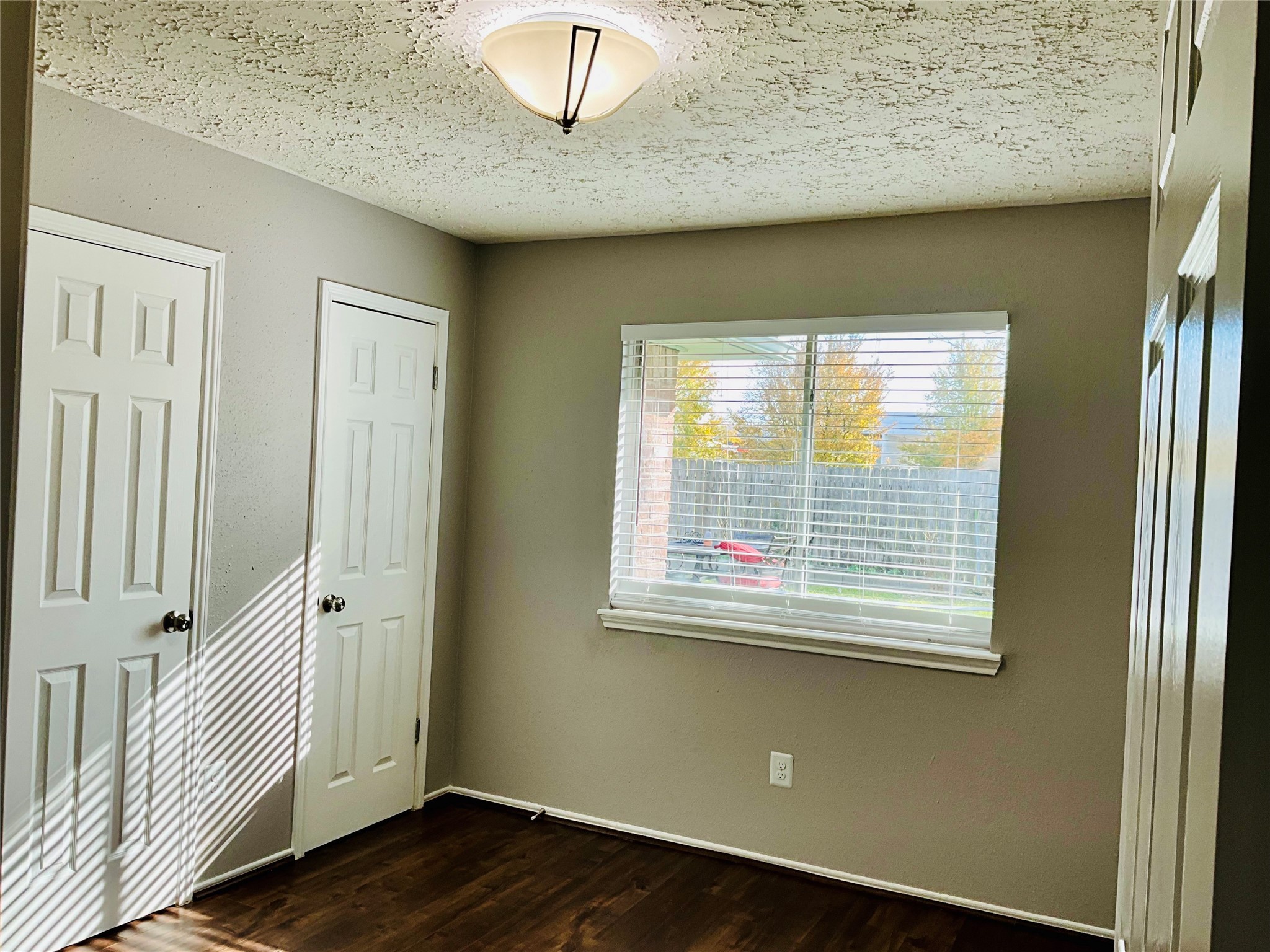 11827 Moss Branch Road Houston, TX 77043 - Photo 24 of 41 a view of a livingroom with wooden floor and a window