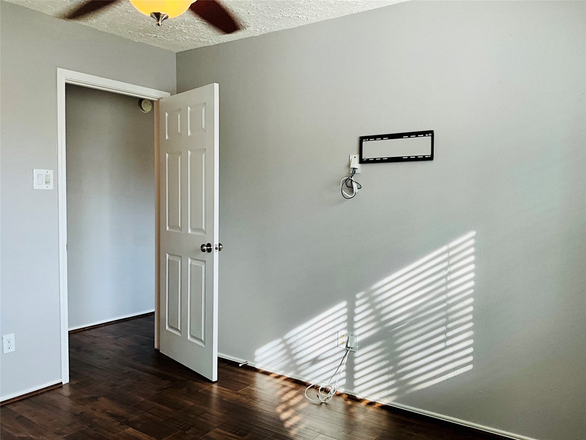 11827 Moss Branch Road Houston, TX 77043 - Photo 30 of 41 a view of a livingroom with wooden floor and a ceiling fan