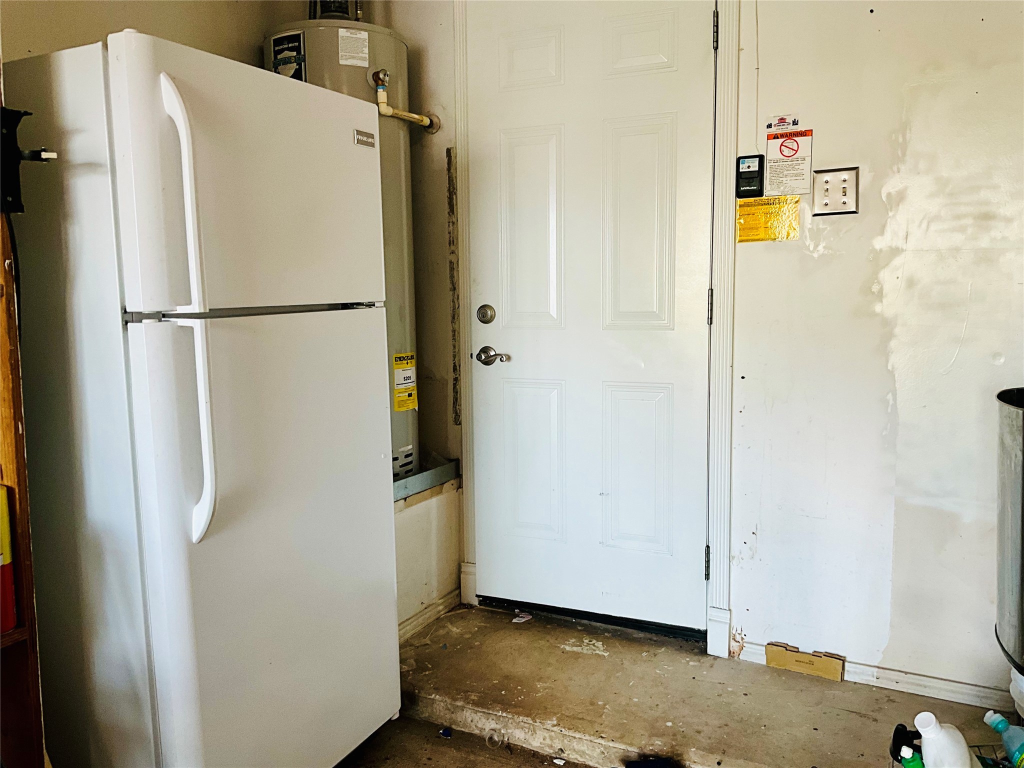 11827 Moss Branch Road Houston, TX 77043 - Photo 36 of 41 a view of a storage & utility room with refrigerator
