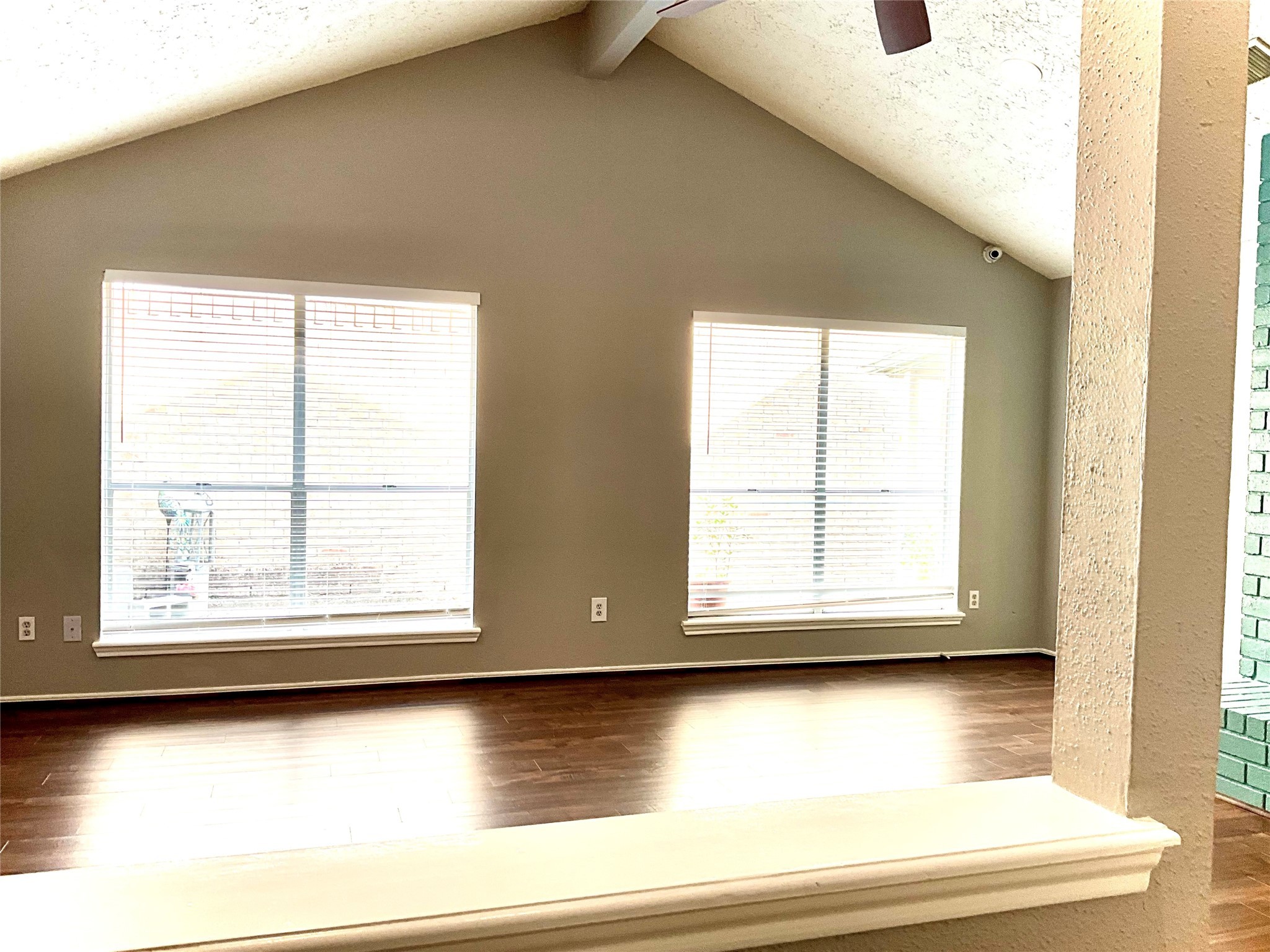 11827 Moss Branch Road Houston, TX 77043 - Photo 4 of 41 an empty room with wooden floor and windows