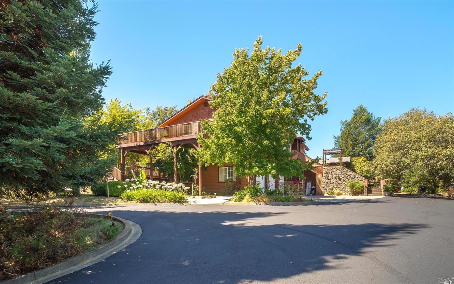 10122 Occidental Road Sebastopol, CA 95472 - Photo 1 of 1 a view of a house with a yard and tree s