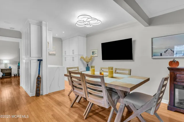 a view of a livingroom with furniture and a flat screen tv