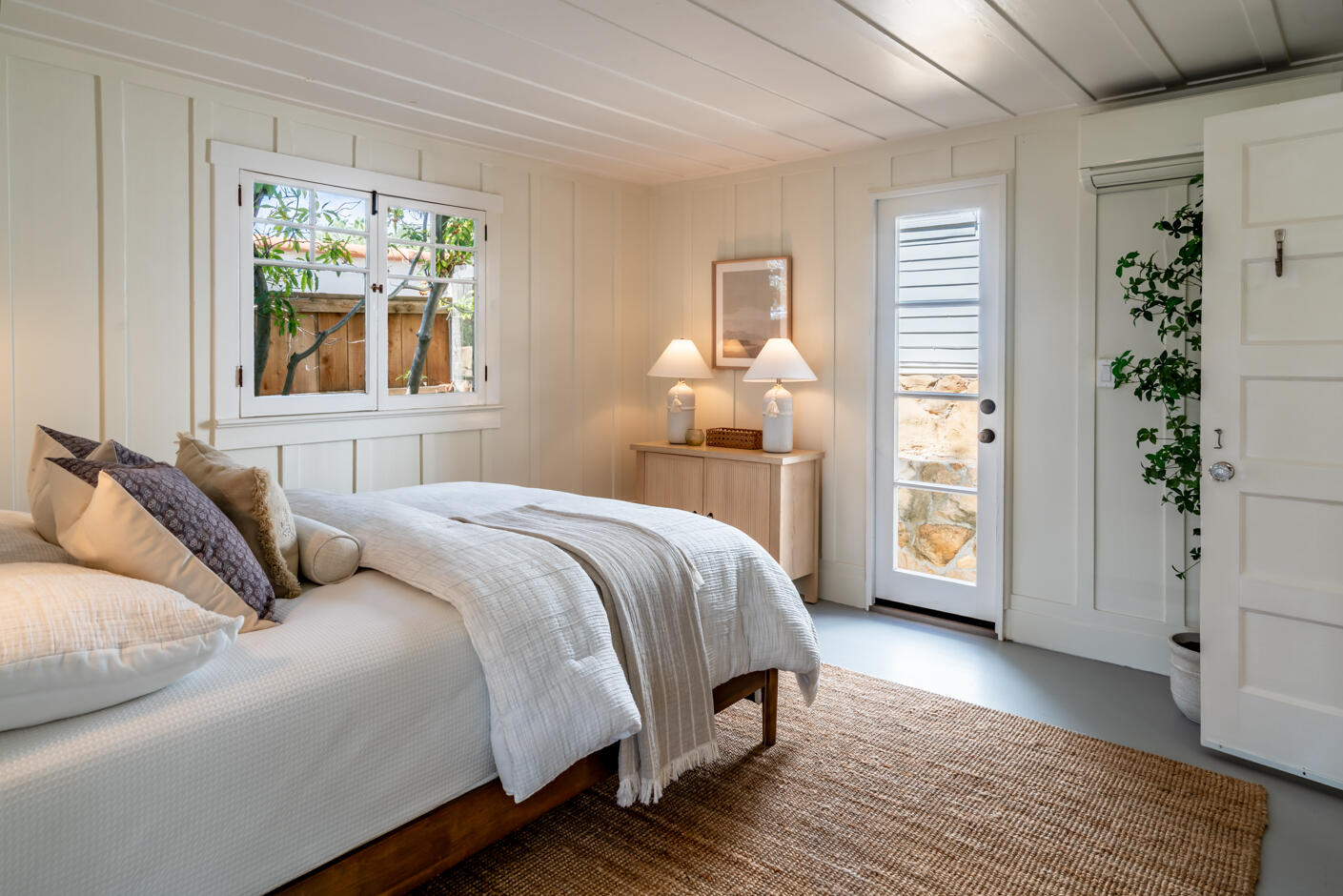 1766 Prospect Avenue Santa Barbara, CA 93103 - Photo 12 of 32 a bedroom with a large bed and a window