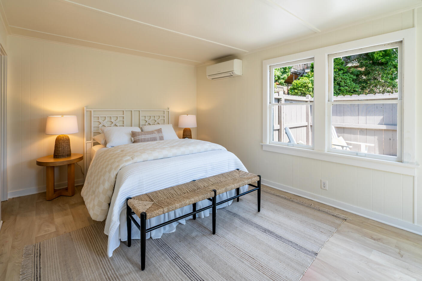 1766 Prospect Avenue Santa Barbara, CA 93103 - Photo 23 of 32 a bedroom with a bed a window and potted plant on the dresser