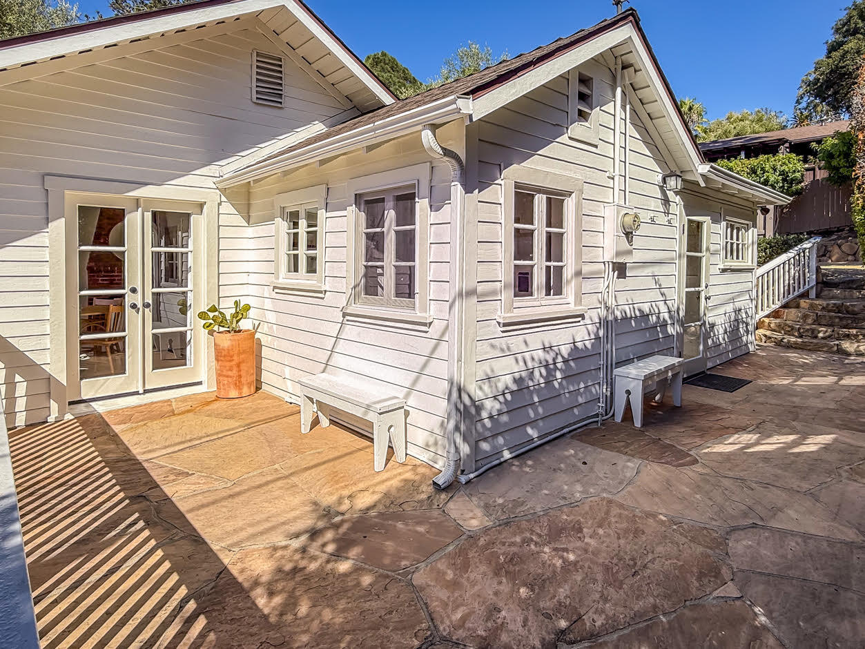 1766 Prospect Avenue Santa Barbara, CA 93103 - Photo 26 of 32 a view of a house with a large window and wooden fence