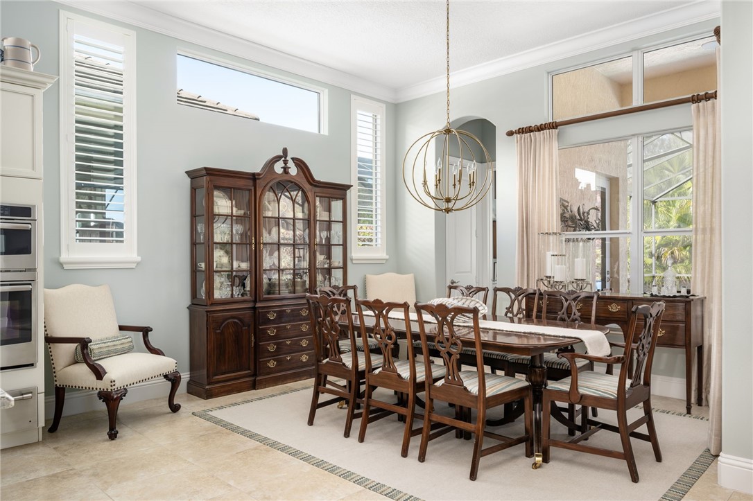 1101 River Wind Circle Vero Beach, FL 32967 - Photo 12 of 36 a view of a dining room with furniture window and outside view