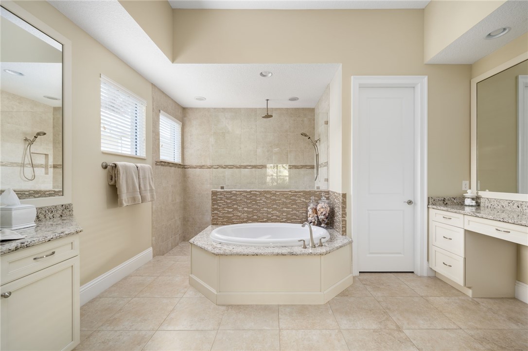 1101 River Wind Circle Vero Beach, FL 32967 - Photo 19 of 36 a bathroom with a sink a toilet and shower
