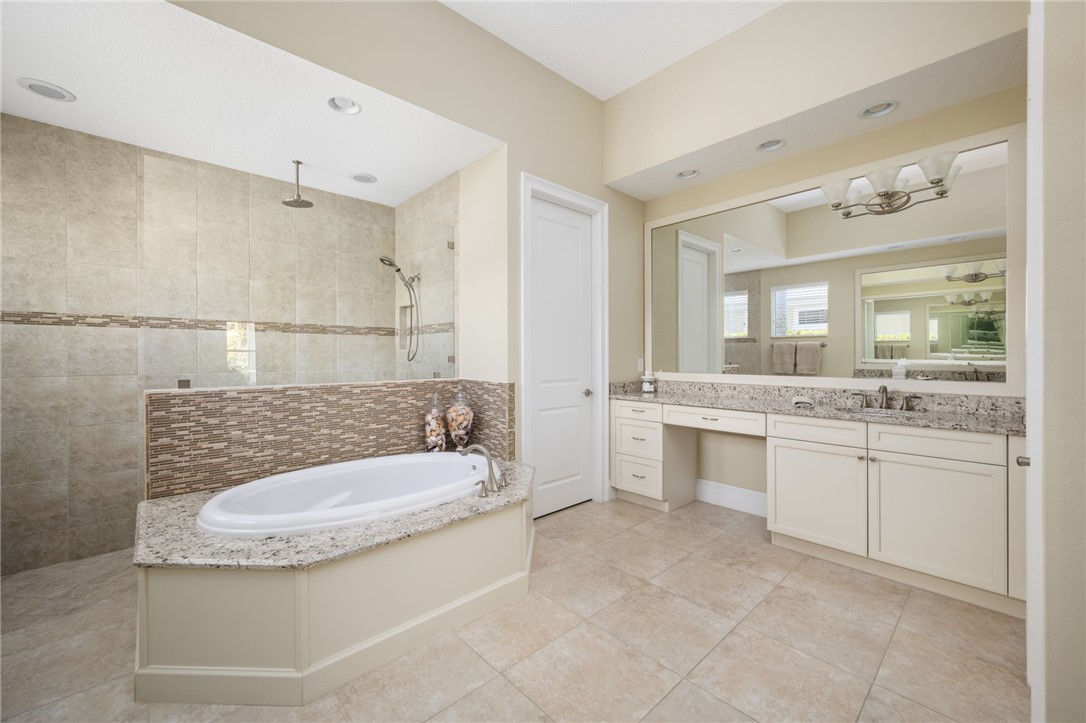 1101 River Wind Circle Vero Beach, FL 32967 - Photo 20 of 36 a bathroom with a sink double vanity and a mirror