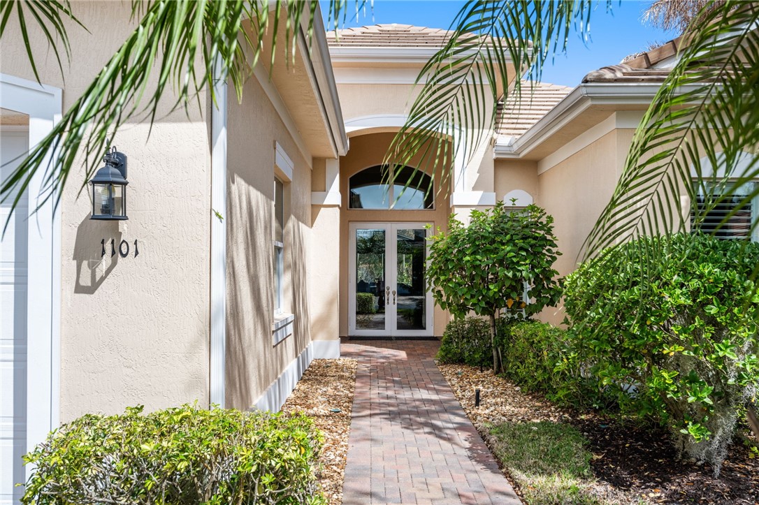 1101 River Wind Circle Vero Beach, FL 32967 - Photo 2 of 36 a view of a house with a yard