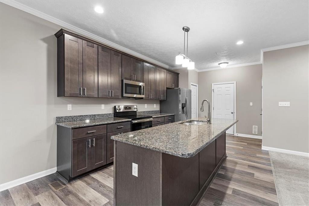 149 Lockheed Drive Coraopolis, PA 15108 - Photo 11 of 48 a kitchen with stainless steel appliances granite countertop a sink stove and refrigerator