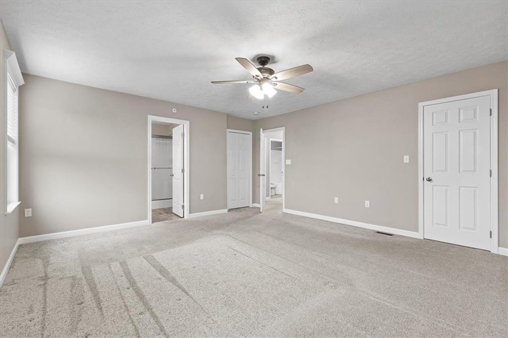 149 Lockheed Drive Coraopolis, PA 15108 - Photo 19 of 48 a view of an empty room with a ceiling fan