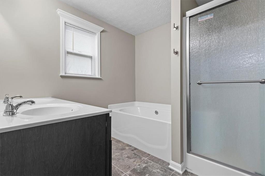 149 Lockheed Drive Coraopolis, PA 15108 - Photo 21 of 48 a bathroom with a tub sink vanity and a mirror