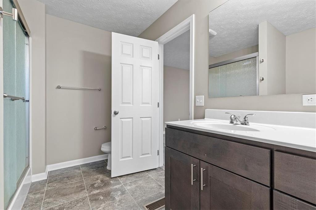 149 Lockheed Drive Coraopolis, PA 15108 - Photo 22 of 48 a bathroom with a sink and a mirror