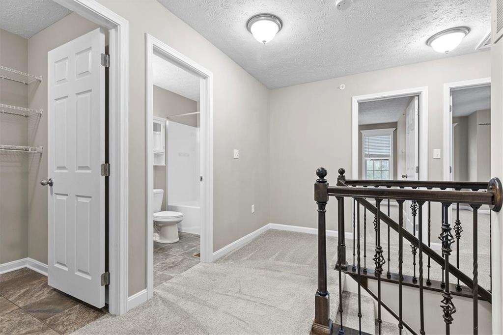 149 Lockheed Drive Coraopolis, PA 15108 - Photo 23 of 48 a view of a hallway with a livingroom and a bathroom