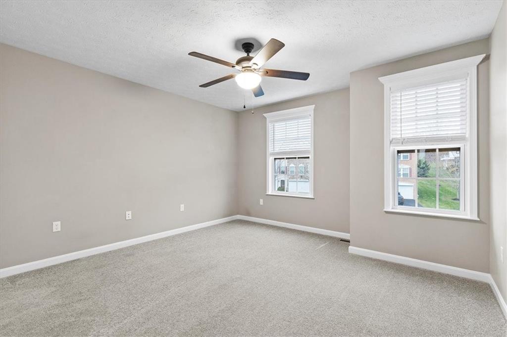 149 Lockheed Drive Coraopolis, PA 15108 - Photo 26 of 48 an empty room with window and ceiling fan